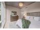Well-lit bedroom with chandelier, hardwood floors, and a comfortable queen-sized bed at 1620 Little Raven St # 103, Denver, CO 80202