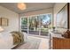Serene bedroom with large windows offering views of the surrounding trees and landscaping at 1620 Little Raven St # 103, Denver, CO 80202