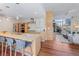 Modern kitchen with stainless appliances, center island with seating, and open floor plan at 1620 Little Raven St # 103, Denver, CO 80202