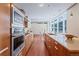 Bright kitchen with stainless steel appliances and breakfast bar perfect for entertaining at 1620 Little Raven St # 103, Denver, CO 80202
