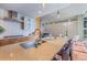 Modern kitchen with stainless steel appliances, island with seating, and open floor plan at 1620 Little Raven St # 103, Denver, CO 80202