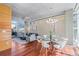 Bright living room featuring hardwood floors, floor to ceiling windows, and modern furnishings at 1620 Little Raven St # 103, Denver, CO 80202
