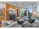 Well-lit living room boasting hardwood floors, large windows, and contemporary furnishings at 1620 Little Raven St # 103, Denver, CO 80202