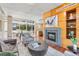 Bright living room features a fireplace, wood accents, and large windows for natural light at 1620 Little Raven St # 103, Denver, CO 80202