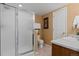 Bright bathroom featuring a glass-enclosed shower, modern fixtures, and neutral decor at 9249 Fox Fire Dr, Highlands Ranch, CO 80129