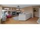 Cozy living room with a modern fireplace, built-in shelves, and hardwood floors throughout at 9249 Fox Fire Dr, Highlands Ranch, CO 80129