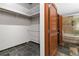 Well-lit bathroom with tub and slate floors at 1863 Wazee St # 6E, Denver, CO 80202