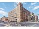 Multi-story brick building with large windows, captured on a clear day, from street level at 1863 Wazee St # 6E, Denver, CO 80202