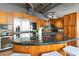 Spacious kitchen with wood cabinets, stainless steel appliances, a gas stovetop, and a large island at 1863 Wazee St # 6E, Denver, CO 80202
