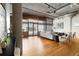 Bright and airy living room with exposed pipes, concrete ceiling, and large windows providing city views at 1863 Wazee St # 6E, Denver, CO 80202