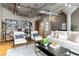 Inviting living room with concrete ceilings, neutral decor, modern furnishings, and hardwood floors at 1863 Wazee St # 6E, Denver, CO 80202