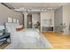 Bright main bedroom boasting hardwood floors, a modern rug, and plenty of natural light from the large windows at 1863 Wazee St # 6E, Denver, CO 80202