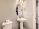 Charming powder room with pedestal sink, oval mirror, and new fixtures at 23545 E Platte Dr # C, Aurora, CO 80016
