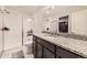 Full bathroom with glass shower, granite countertop, and a walk-in closet at 23545 E Platte Dr # C, Aurora, CO 80016