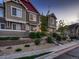 Townhouse exterior featuring green siding, stone accents, and landscaped front yard at 23545 E Platte Dr # C, Aurora, CO 80016