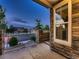 Townhouse exterior with brick accents, a covered porch, and view of community amenities at 23545 E Platte Dr # C, Aurora, CO 80016