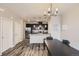Modern kitchen featuring stainless steel appliances, granite countertops, dark cabinetry, and stylish lighting at 23545 E Platte Dr # C, Aurora, CO 80016