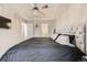 Spacious main bedroom featuring a tufted headboard and tray ceiling at 23545 E Platte Dr # C, Aurora, CO 80016