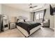 Comfortable main bedroom with tray ceilings, fan, and large windows at 23545 E Platte Dr # C, Aurora, CO 80016