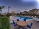 Community pool with lounge chairs and outdoor seating with nearby residential buildings at 23545 E Platte Dr # C, Aurora, CO 80016