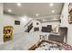 Finished basement with stairs, sitting areas, and a spacious open floor plan at 25059 E Alder Dr, Aurora, CO 80016