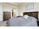 This main bedroom boasts great closet access, neutral walls, and soft carpet at 25059 E Alder Dr, Aurora, CO 80016