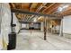An unfinished basement with exposed beams, ready for customization and future expansion at 3823 Horiuchi St, Brighton, CO 80601