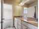 Bathroom with a double sink vanity and a large mirror, offering a functional space at 3823 Horiuchi St, Brighton, CO 80601