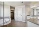 A spacious bathroom includes a soaking tub, enclosed shower, and separate vanity area at 3823 Horiuchi St, Brighton, CO 80601