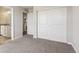 Bedroom view leading to bathroom and closet with sliding doors at 3823 Horiuchi St, Brighton, CO 80601