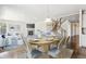 Bright dining room and living space features an inviting open layout with a fireplace and plenty of natural light at 3823 Horiuchi St, Brighton, CO 80601