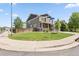 Corner lot home with a well-maintained lawn and street sign at the intersection at 3823 Horiuchi St, Brighton, CO 80601
