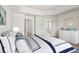 A serene main bedroom features a tray ceiling, ensuite bath, and walk-in closet at 3823 Horiuchi St, Brighton, CO 80601