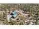 Aerial view of a charming wood home with a green roof surrounded by a dense forest at 14800 Gold Hill Rd, Boulder, CO 80302