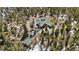 A lovely wood home and separate building with green roofs surrounded by a dense forest at 14800 Gold Hill Rd, Boulder, CO 80302