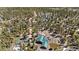 A charming home with a green roof surrounded by a dense forest and a dirt road nearby at 14800 Gold Hill Rd, Boulder, CO 80302