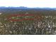 Aerial view of the property highlighting the boundary within a dense forest at 14800 Gold Hill Rd, Boulder, CO 80302