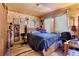 Bedroom featuring wood walls, closet, and window with curtains and decor at 14800 Gold Hill Rd, Boulder, CO 80302