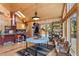 Inviting dining area with hardwood floors, skylights, and large windows showcasing the natural surroundings at 14800 Gold Hill Rd, Boulder, CO 80302