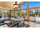 Dining room with a table, chairs, and cathedral windows that look out at the trees at 14800 Gold Hill Rd, Boulder, CO 80302