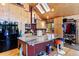 Bright kitchen featuring custom cabinets, skylights, and a large island at 14800 Gold Hill Rd, Boulder, CO 80302