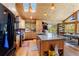 Spacious kitchen features an island, modern appliances, wood cabinets, and plenty of natural light at 14800 Gold Hill Rd, Boulder, CO 80302