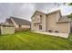 A spacious yard with lush green lawn, shed, patio and BBQ grill at 4426 Windmill Dr, Brighton, CO 80601