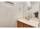Bathroom featuring a single vanity, sink and mirror at 4426 Windmill Dr, Brighton, CO 80601
