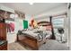 This quirky bedroom features a large bed, carpeted floors, and plenty of unique decor at 4426 Windmill Dr, Brighton, CO 80601