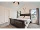 Bright main bedroom with large bed and windows at 4426 Windmill Dr, Brighton, CO 80601