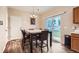 Dining area featuring backyard access via sliding glass door, a dining table, and 6 chairs at 4426 Windmill Dr, Brighton, CO 80601