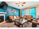 Comfortable living room featuring a fireplace, stylish furniture, and ample seating at 4426 Windmill Dr, Brighton, CO 80601