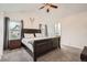 Main bedroom featuring a large bed and carpet at 4426 Windmill Dr, Brighton, CO 80601