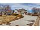 Charming two-story home with a well-manicured lawn and a long driveway at 3188 Soaring Eagle Ln, Castle Rock, CO 80109